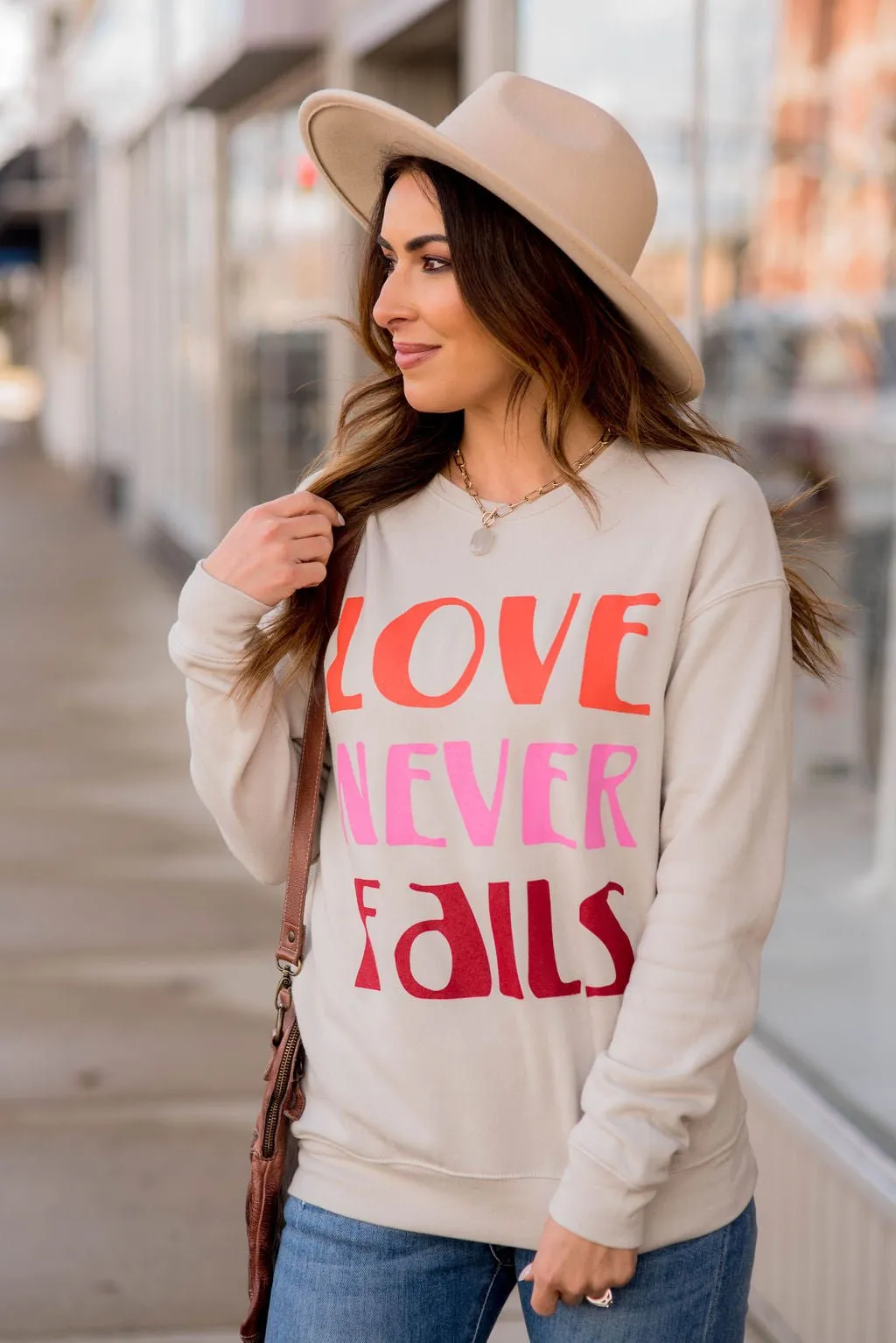 Love Never Fails Graphic Crewneck